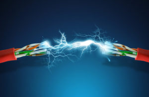 High voltage spark between two cables.